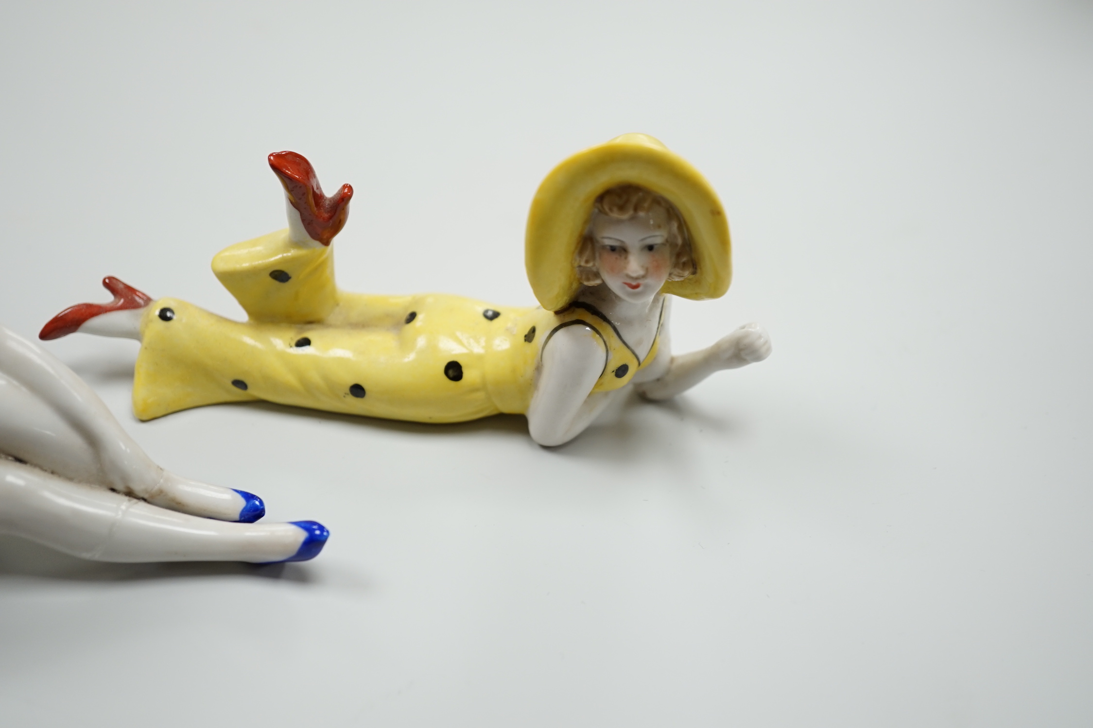 Two German Art Deco porcelain models of bathing beauties, longest 14.5cm